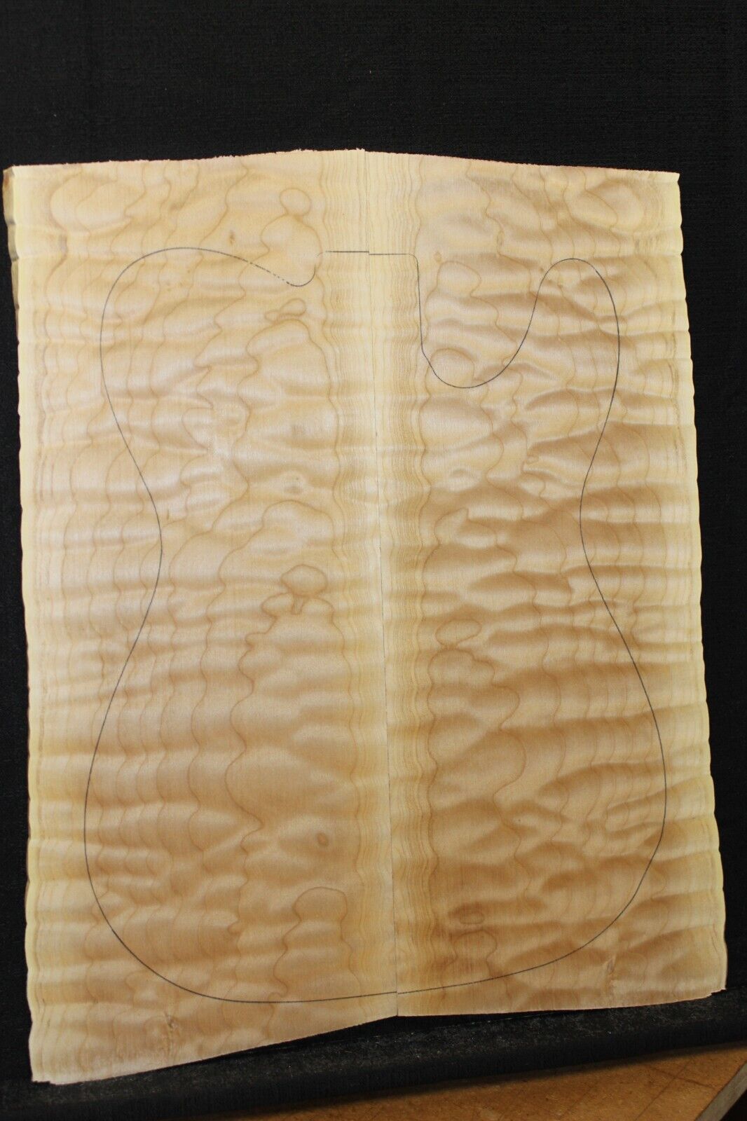 Quilted maple book matched guitar drop top. 5A figure, telly size