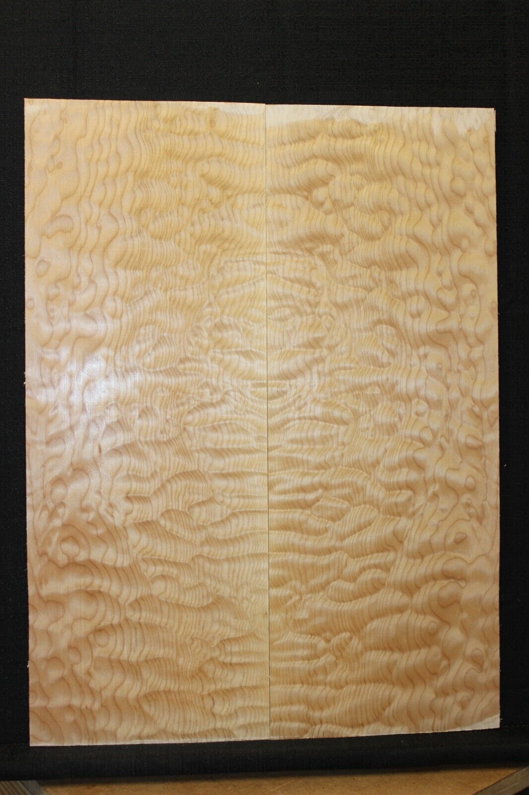 Quilted maple book matched guitar drop top.