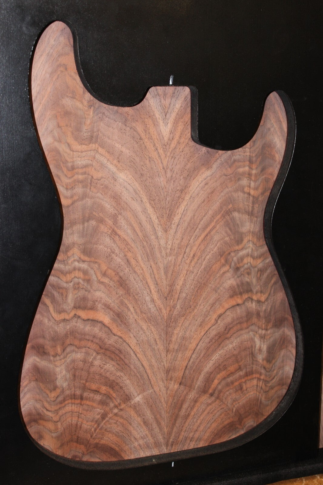 Black walnut crotch figured book matched guitar top.