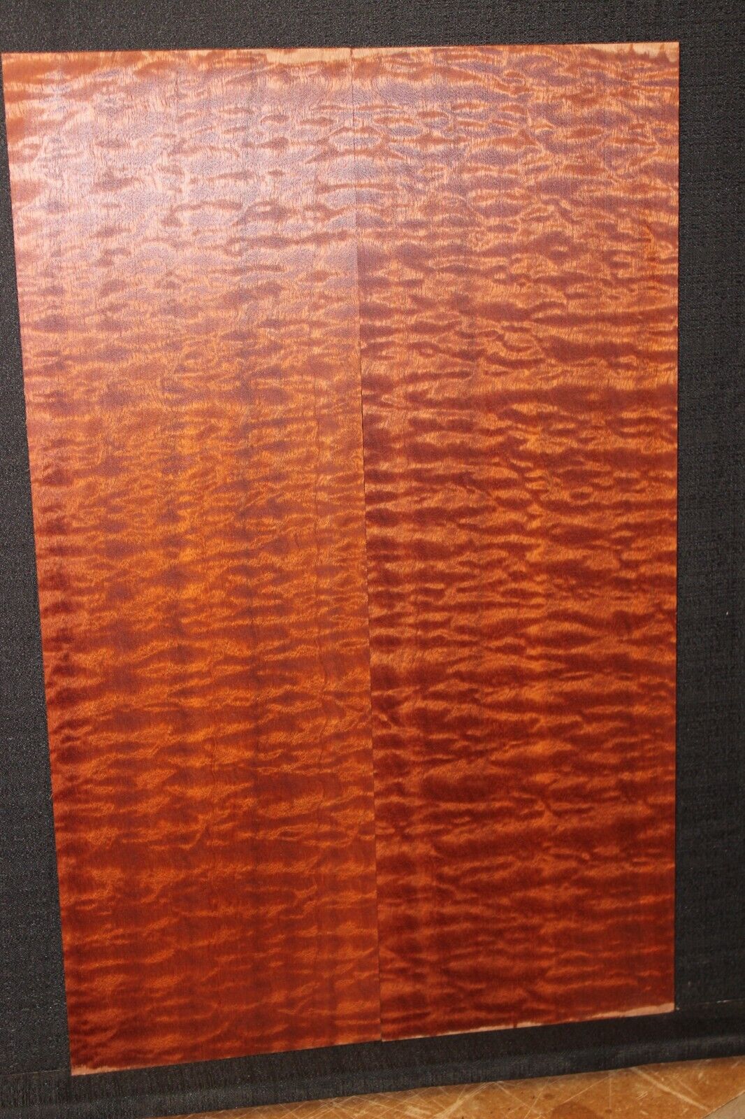 Quilted figured sapele guitar bookmatched drop top.