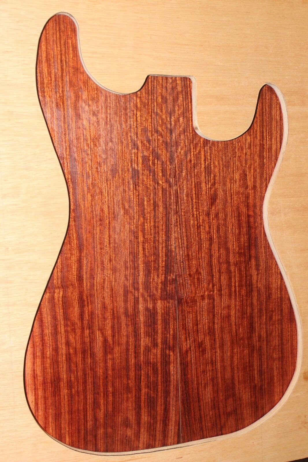 Figured quarter sawn bubinga guitar drop top.