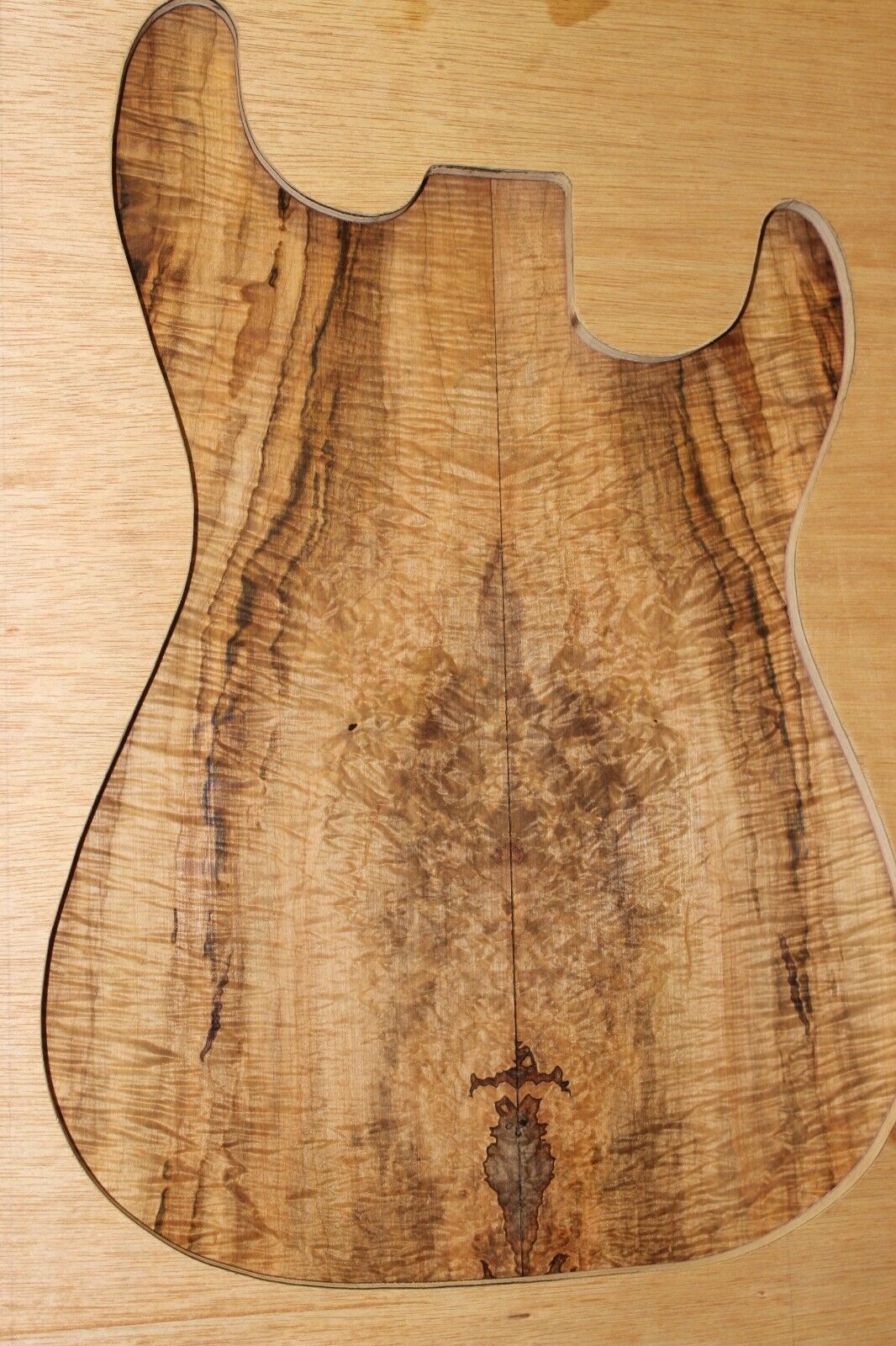 Figured ambrosia maple book matched guitar top, insane figure and color.