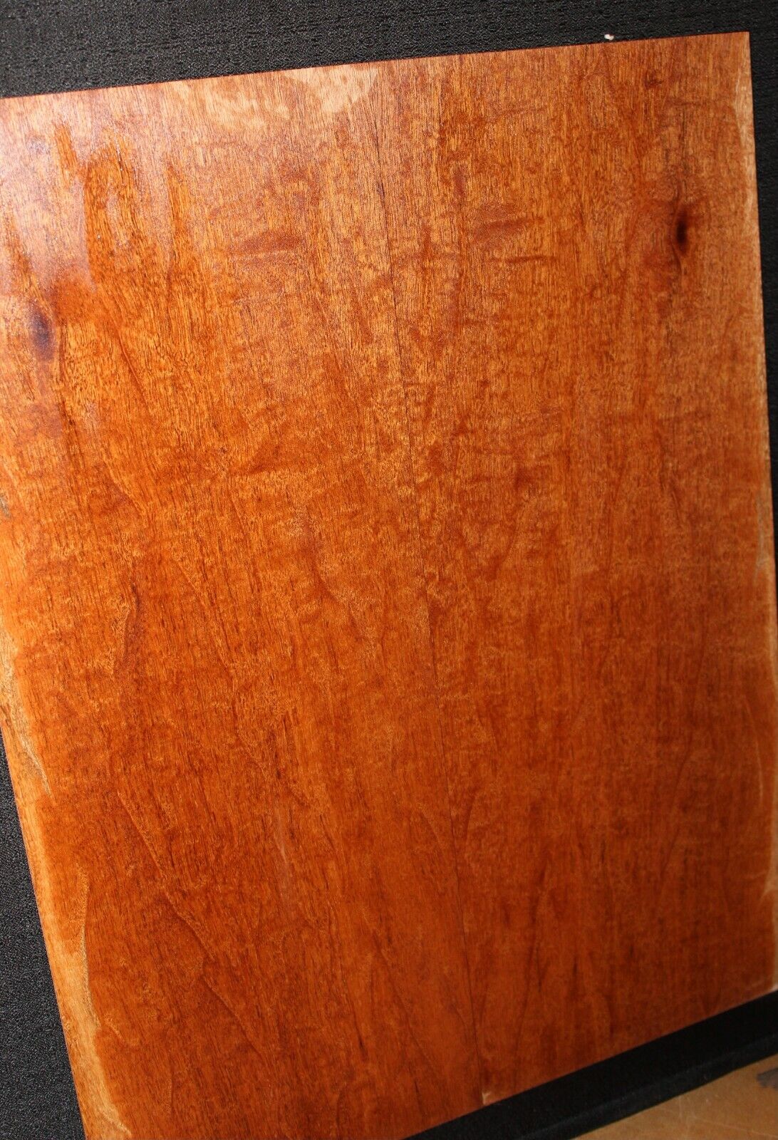 Figured genuine mahogany bookmatched electric guitar drop top.