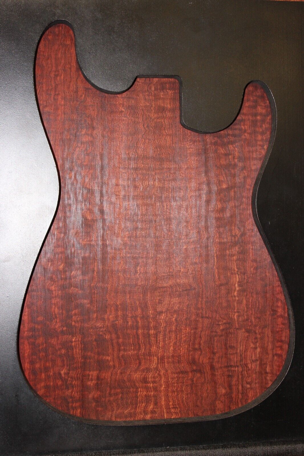 Figured bubinga electric guitar drop top. Curly / pomelle figure & rich color.