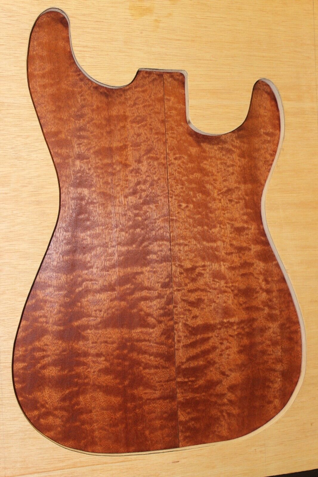 Quilted figured sapele guitar bookmatched drop top.