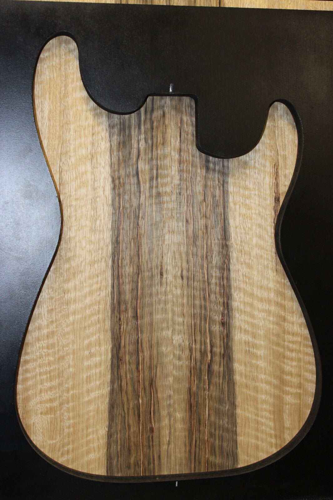 Curly black limba / korina figured book matched guitar top. 0.37" thick