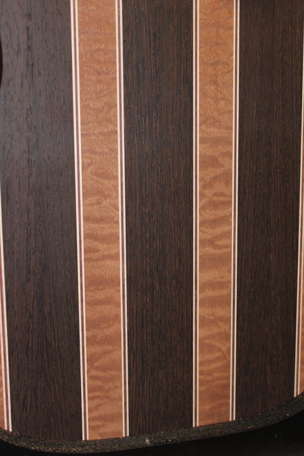 Quilted sapele, wenge, maple and purple-heart laminated electric guitar top.