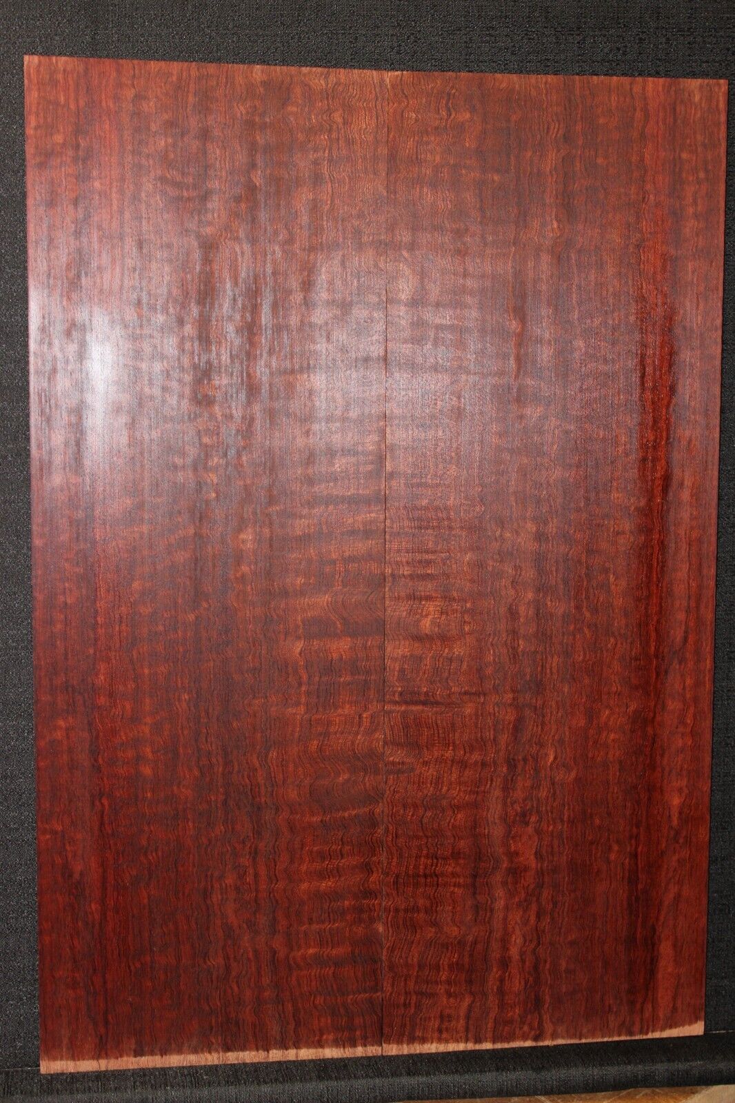 Figured bubinga electric guitar drop top. Curly / pomelle figure & rich color.