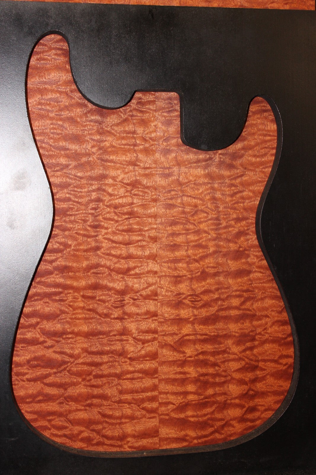 Quilted sapele electric guitar bookmatched drop top. Master grade figure.