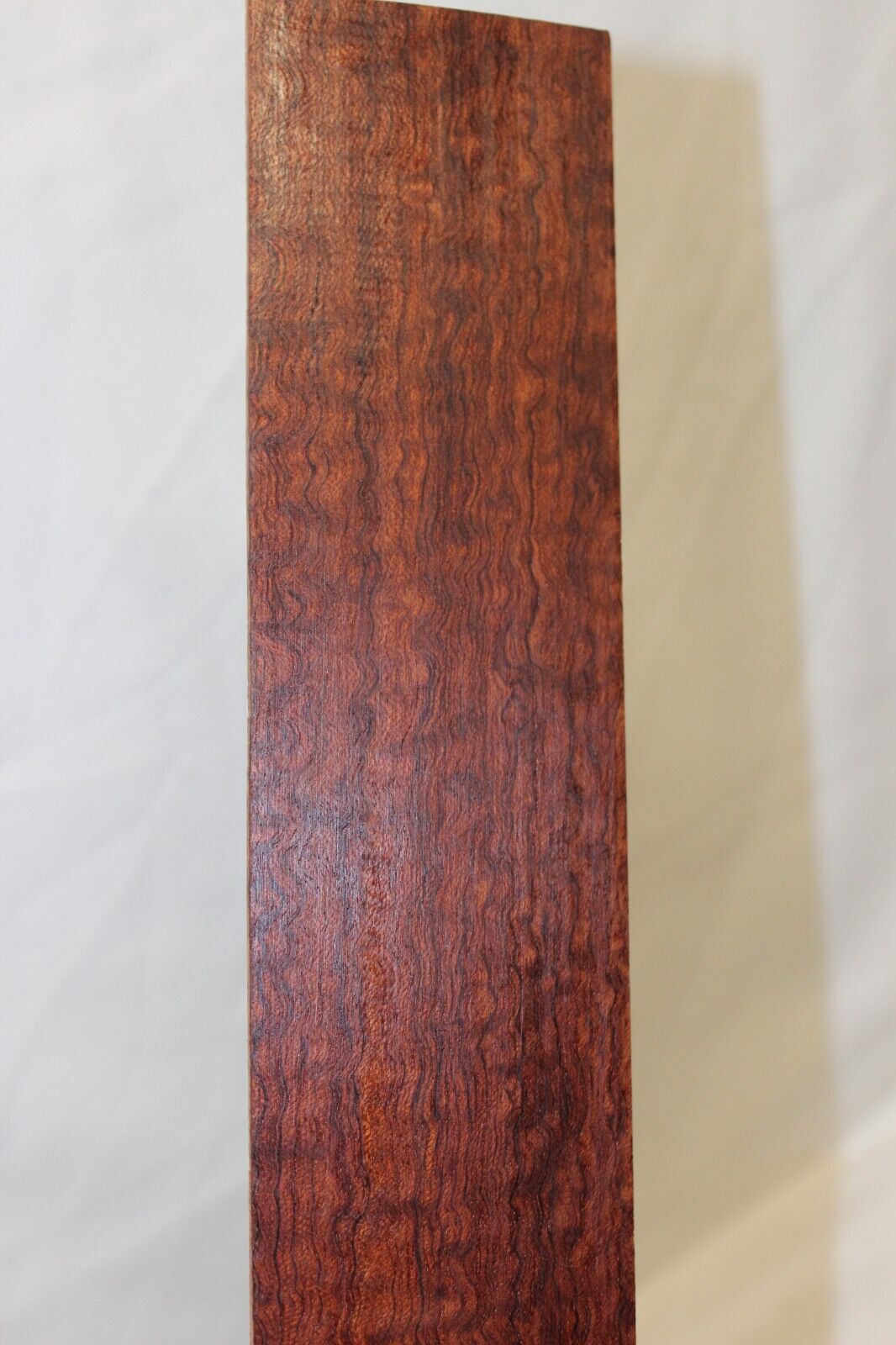 12 inch radius figured bubinga guitar fingerboard blank.