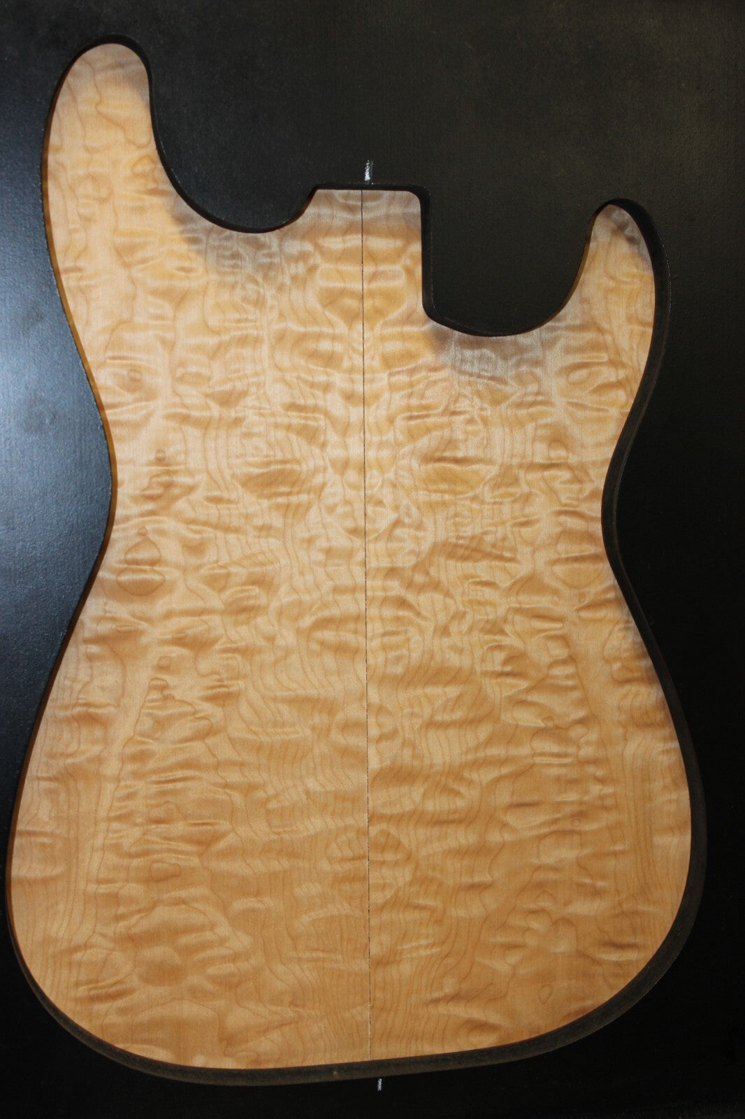 Quilted maple book matched guitar drop top.