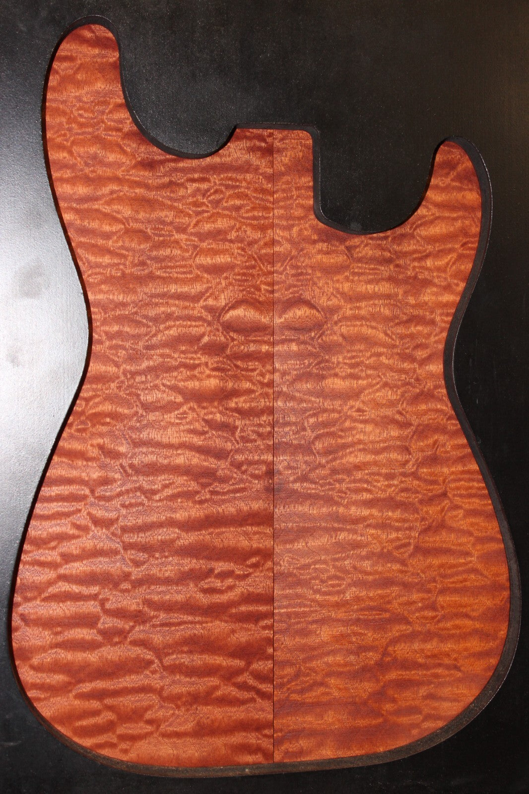 Quilted sapele electric guitar bookmatched drop top. Master grade figure.