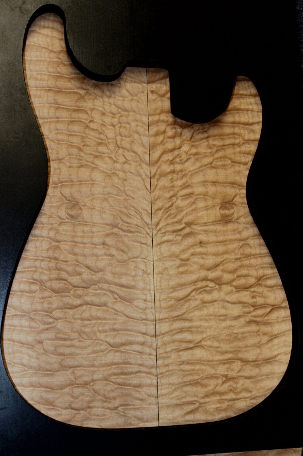 Quilted maple book matched guitar drop top. 5A figure