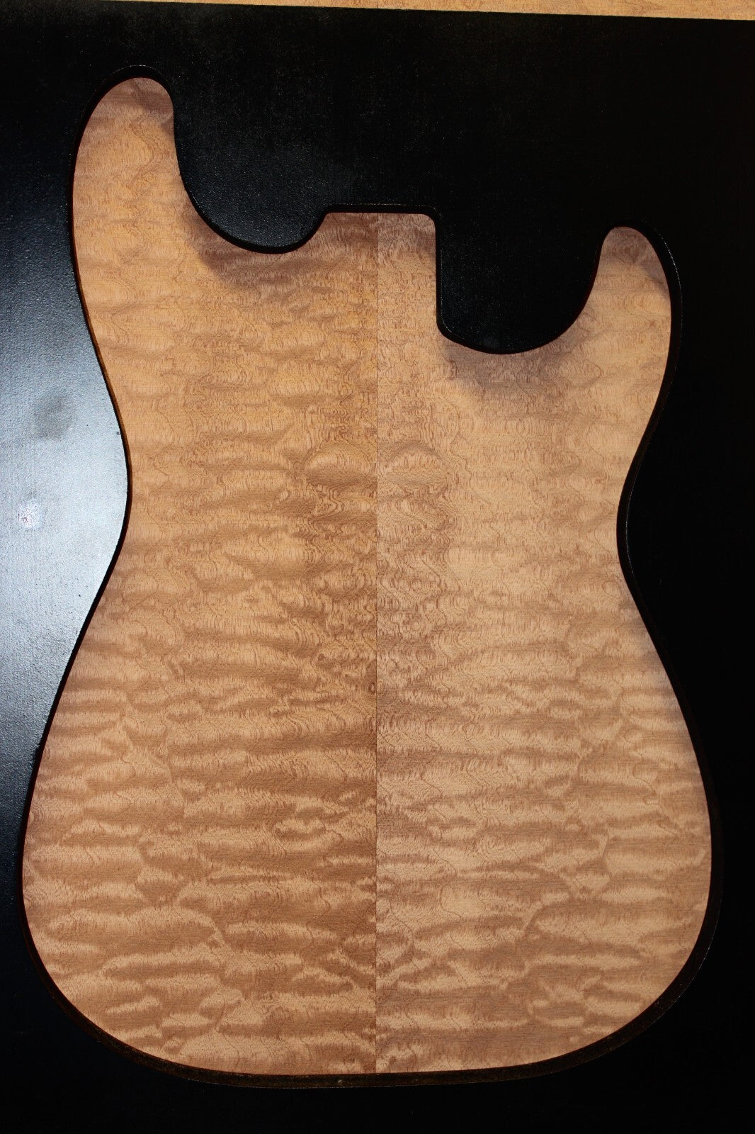 Quilted sapele electric guitar bookmatched drop top. Master grade figure.