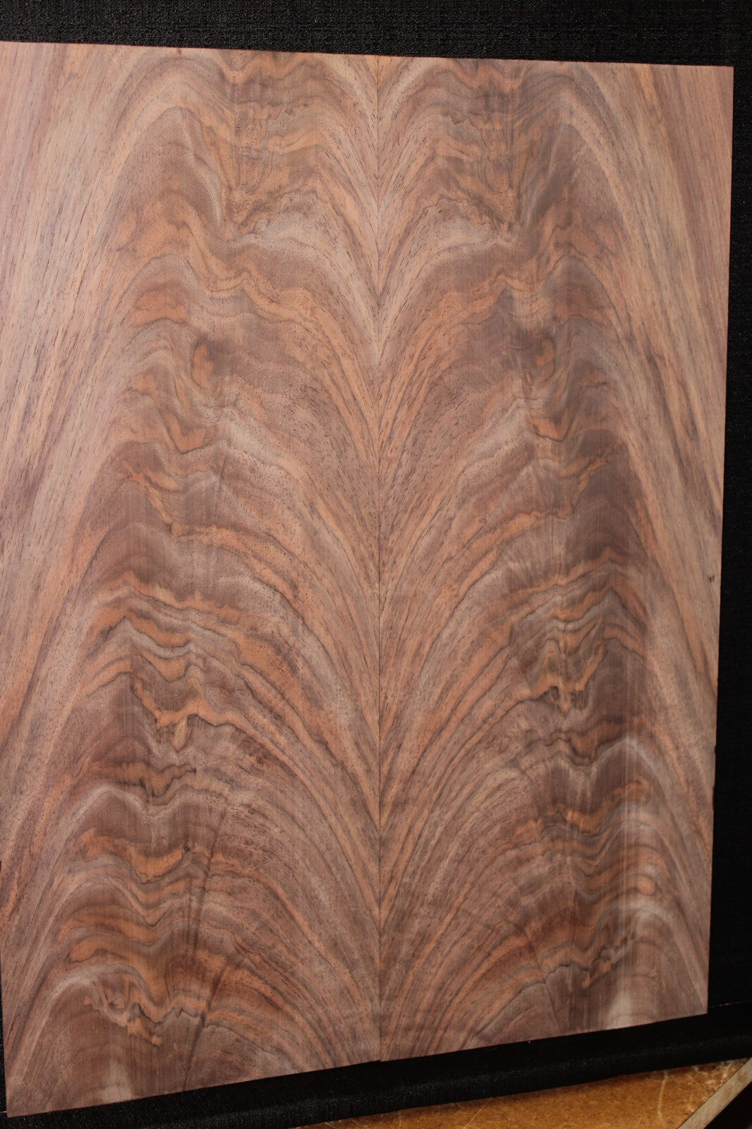 Black walnut crotch figured book matched guitar top.