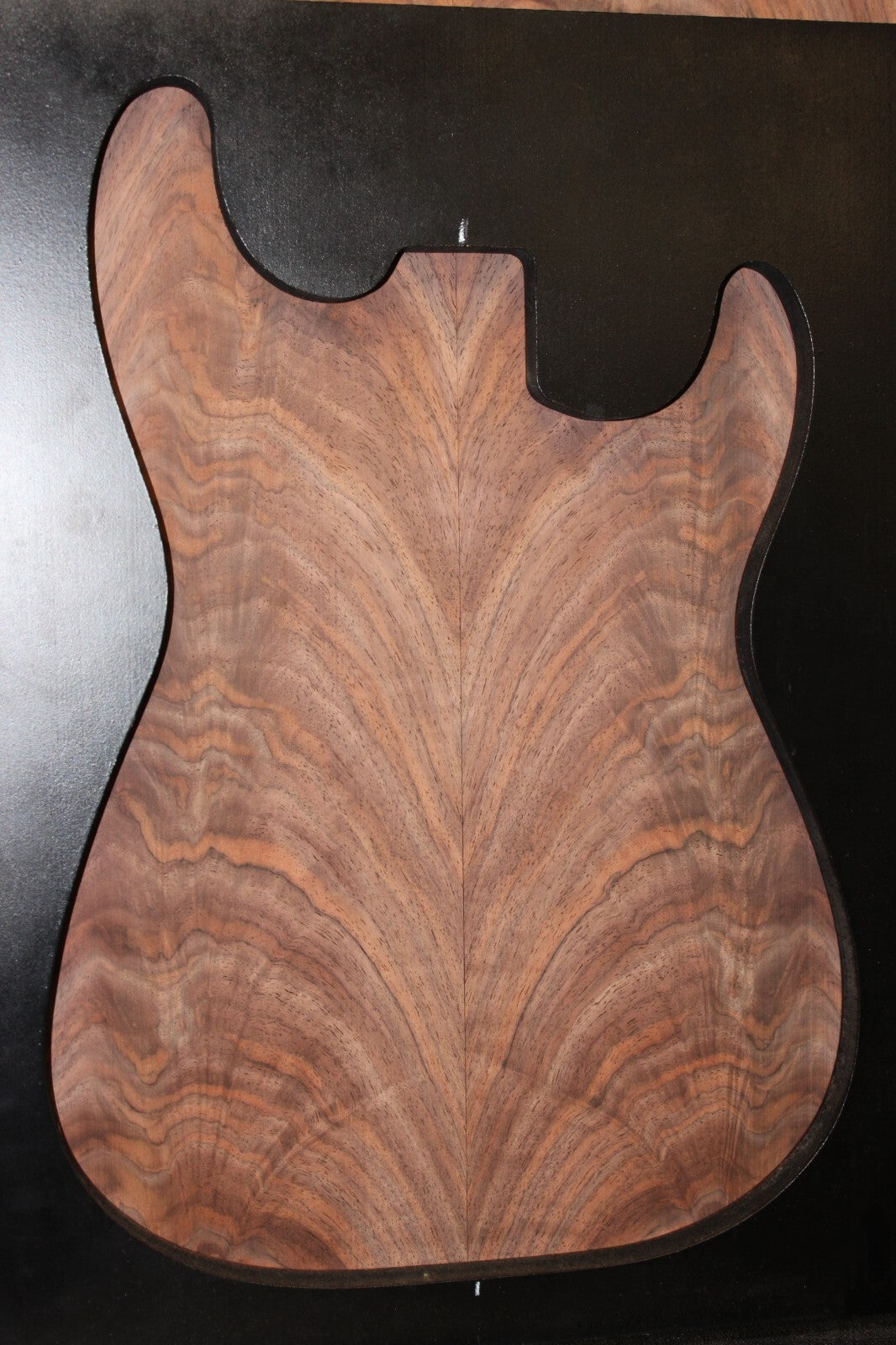Black walnut crotch figured book matched guitar top.