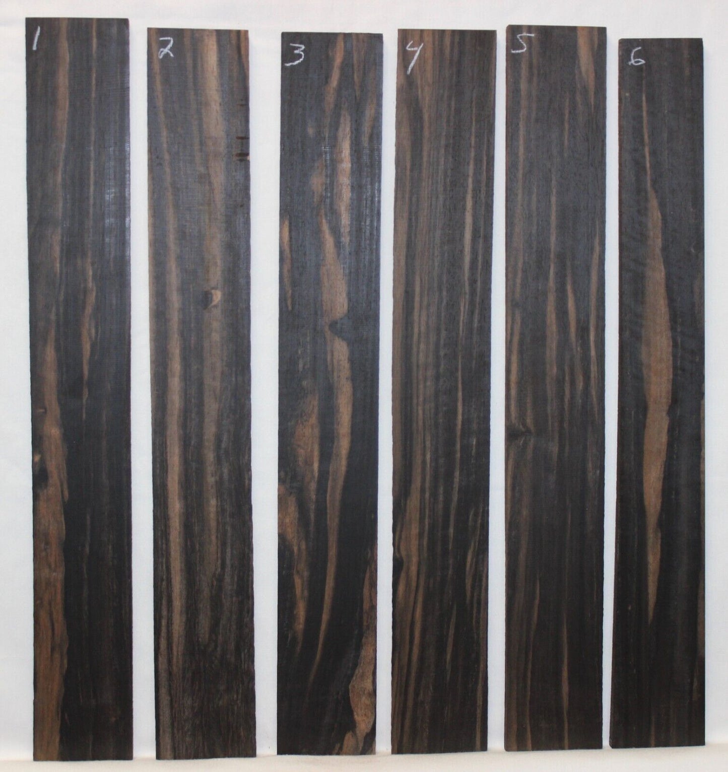 Gaboon ebony guitar fingerboard blanks. Wild color, pale moon ebony like look.