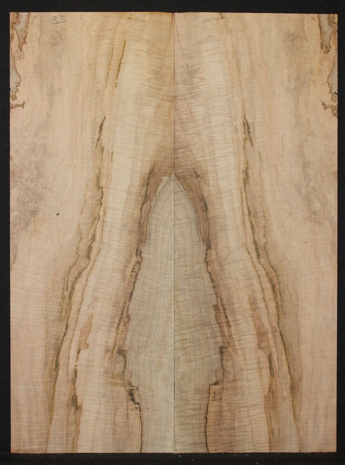 Figured ambrosia maple book matched guitar top, insane figure and color.