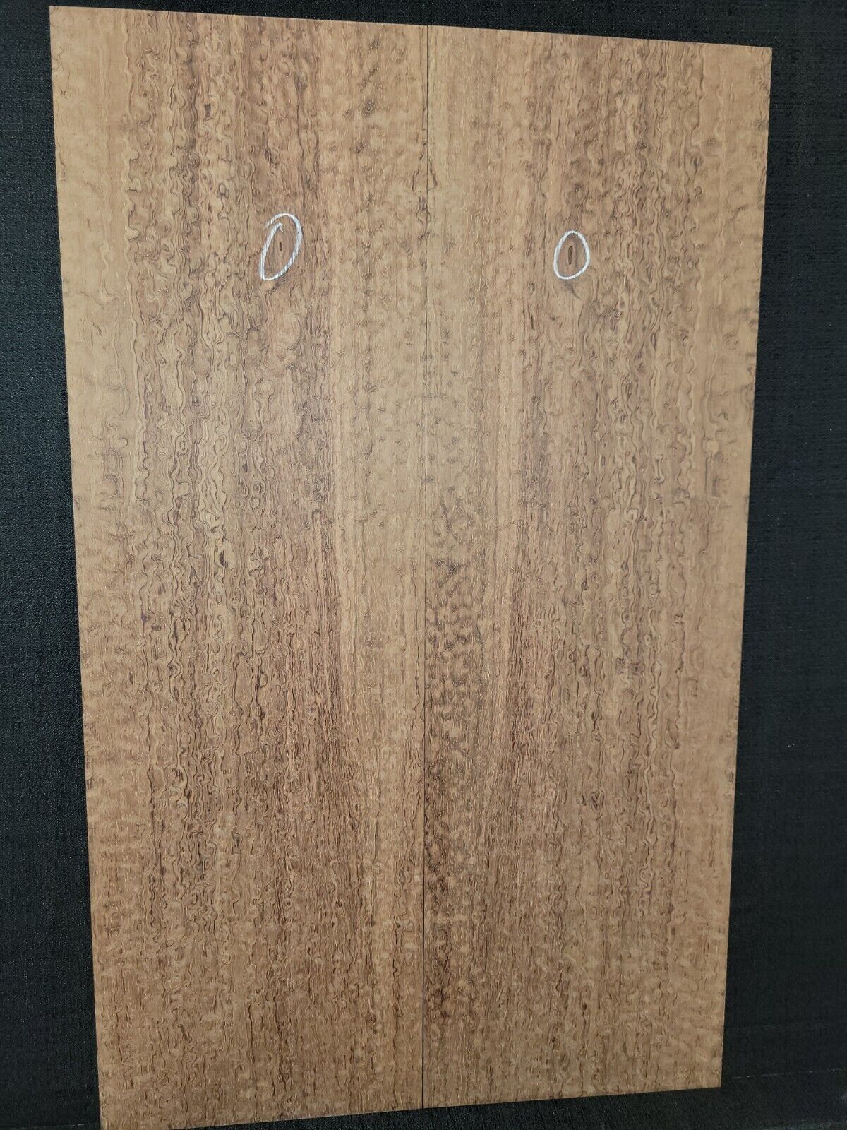 Pomelle figured bubinga electric guitar drop top.