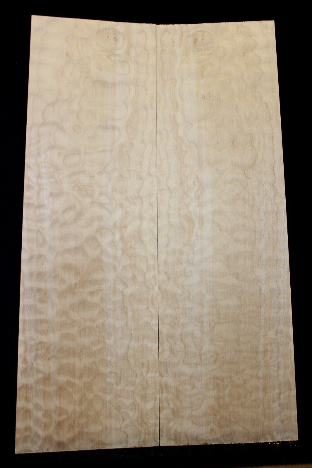 Quilted maple book matched guitar drop top.