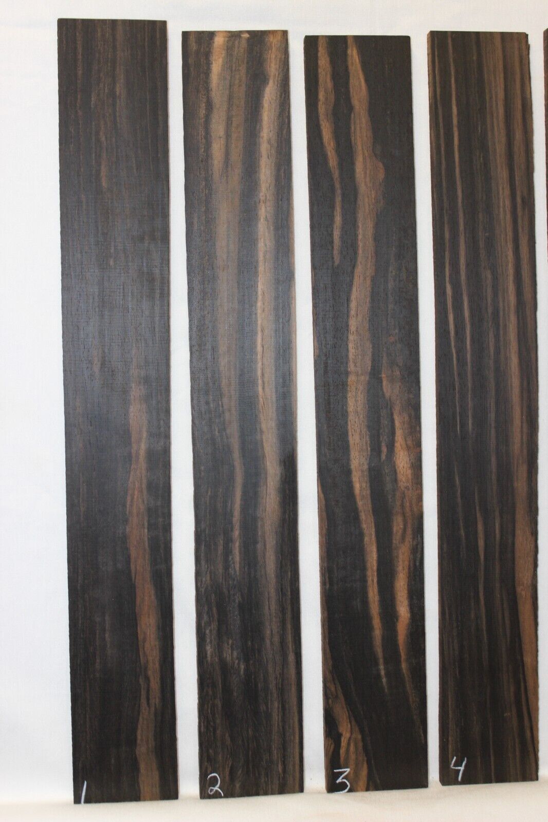 Gaboon ebony guitar fingerboard blanks. Wild color, pale moon ebony like look.