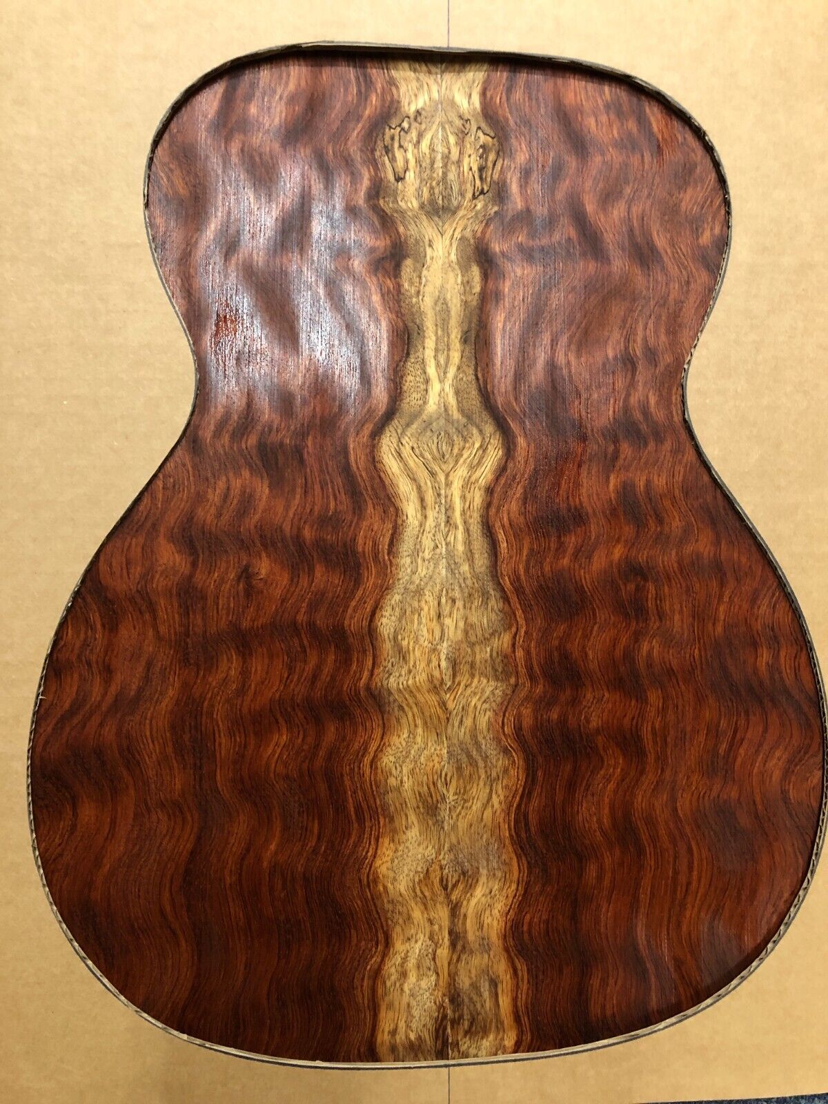 Waterfall figured bubinga back and side set. Stunning grain, color and figure.