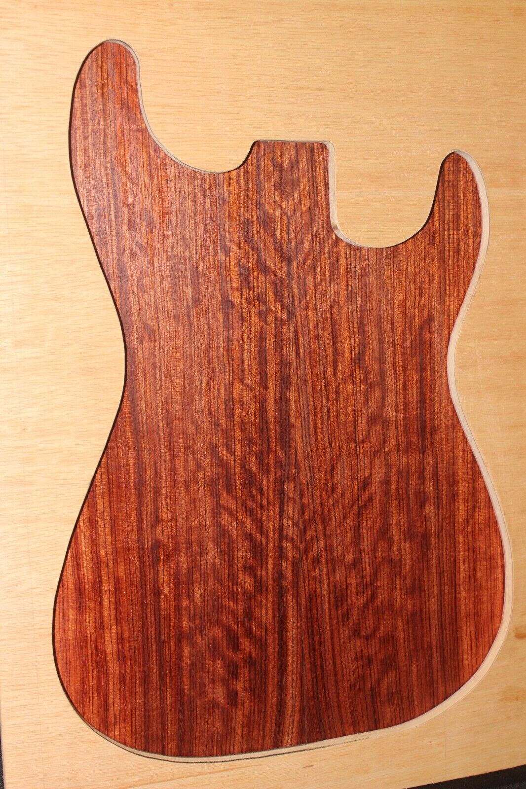 Figured quarter sawn bubinga guitar drop top.