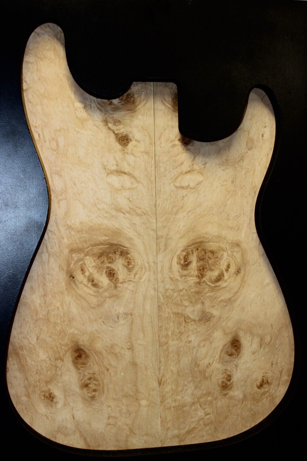 Silver maple, burl / lace figured guitar book matched top.