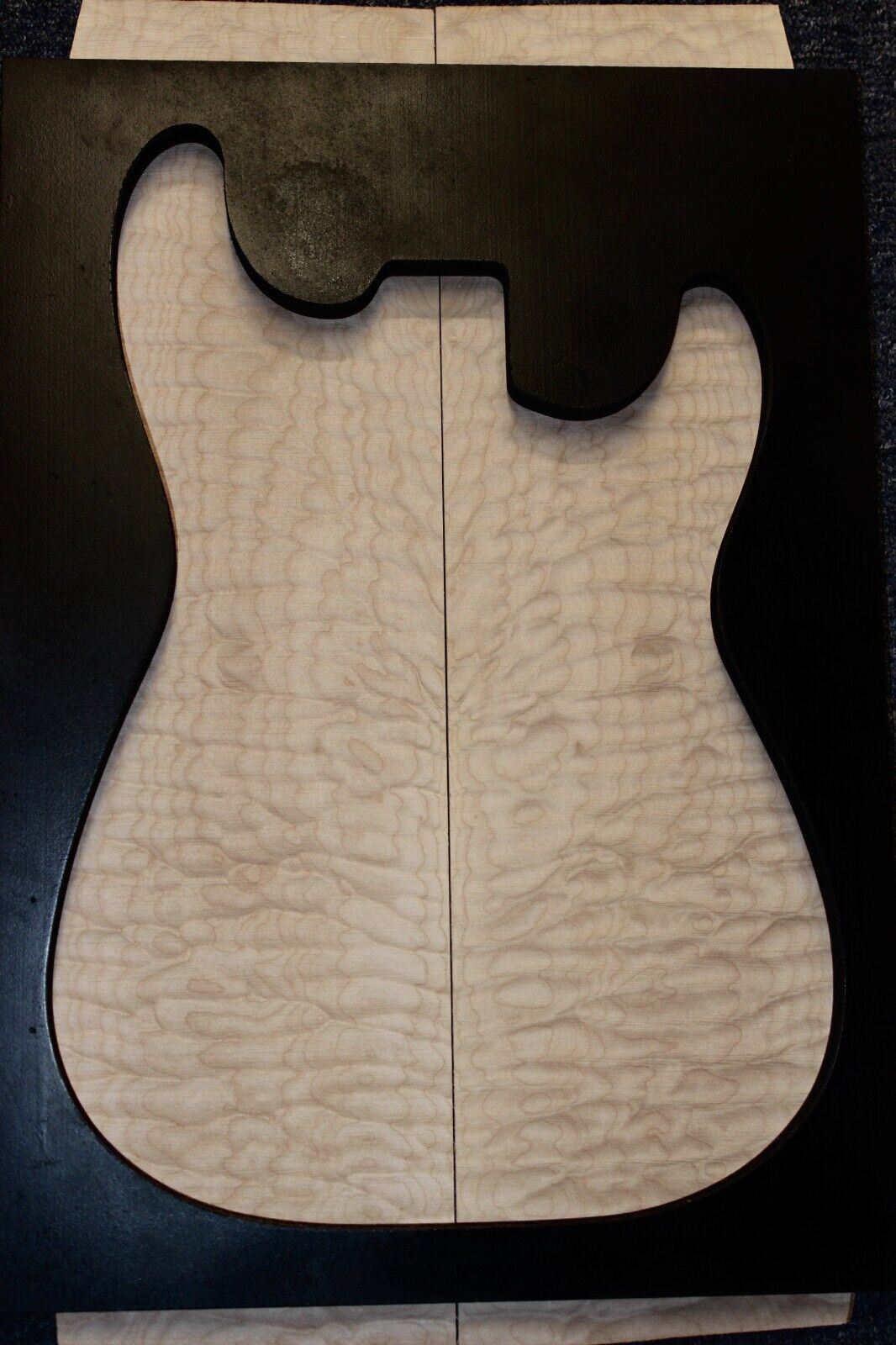 Quilted maple book matched guitar drop top. 5A figure
