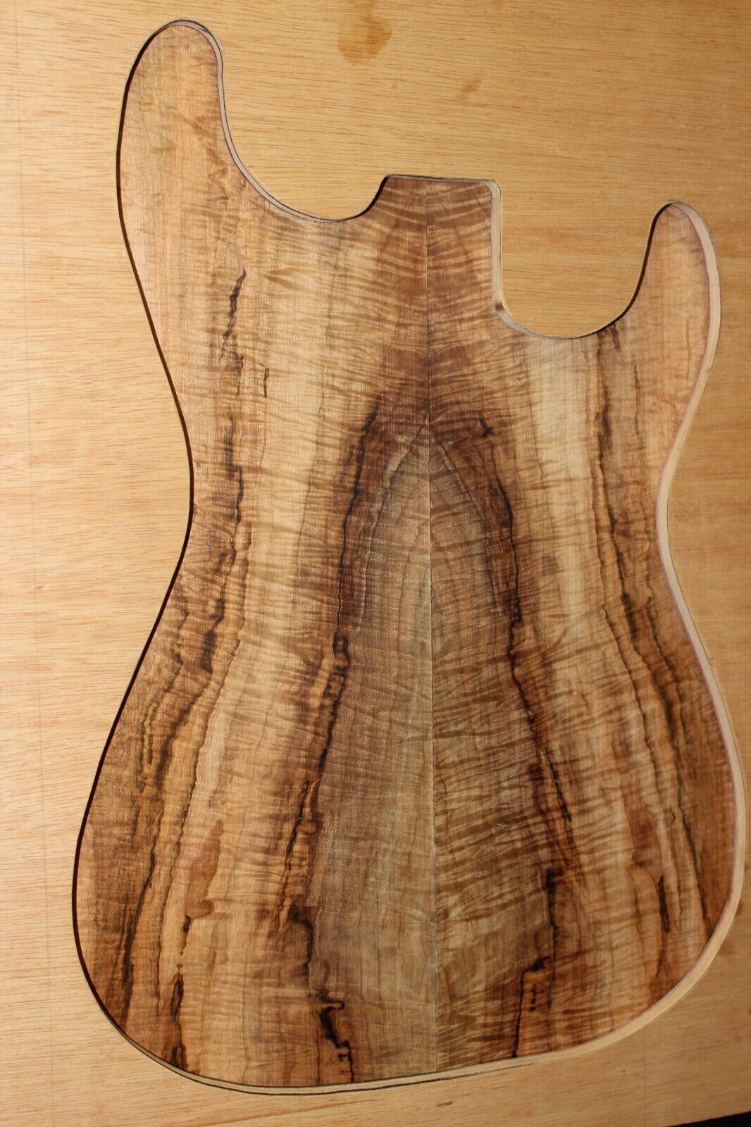 Figured ambrosia maple book matched guitar top, insane figure and color.