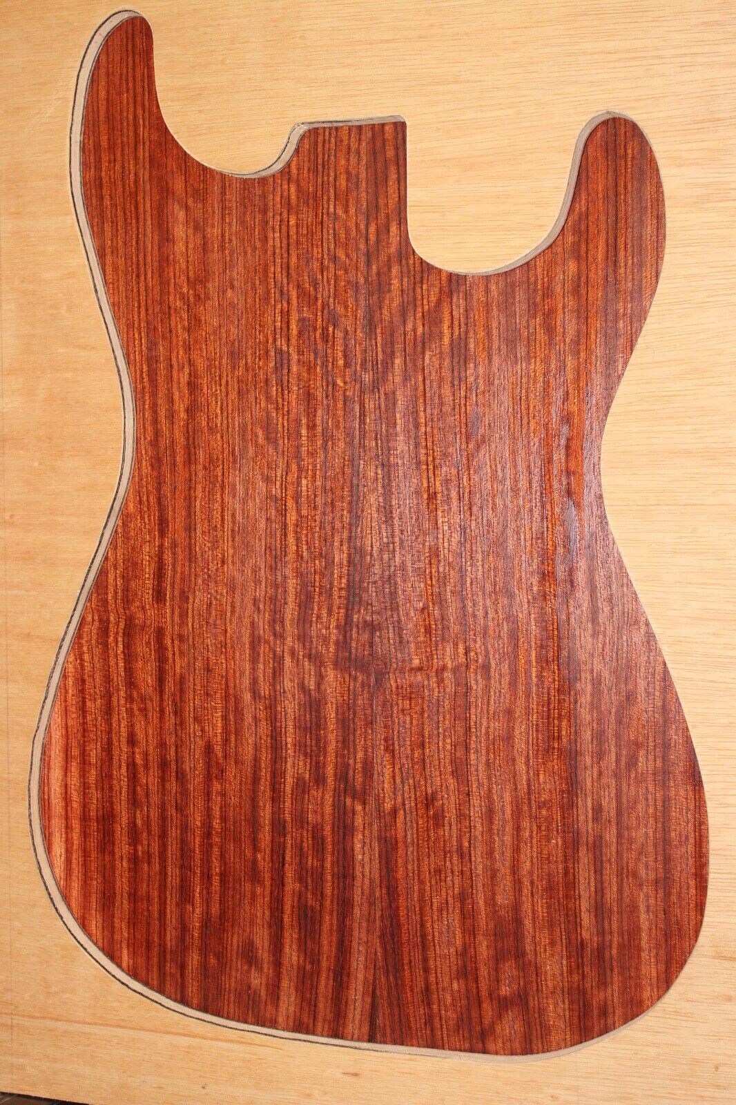Figured quarter sawn bubinga guitar drop top.