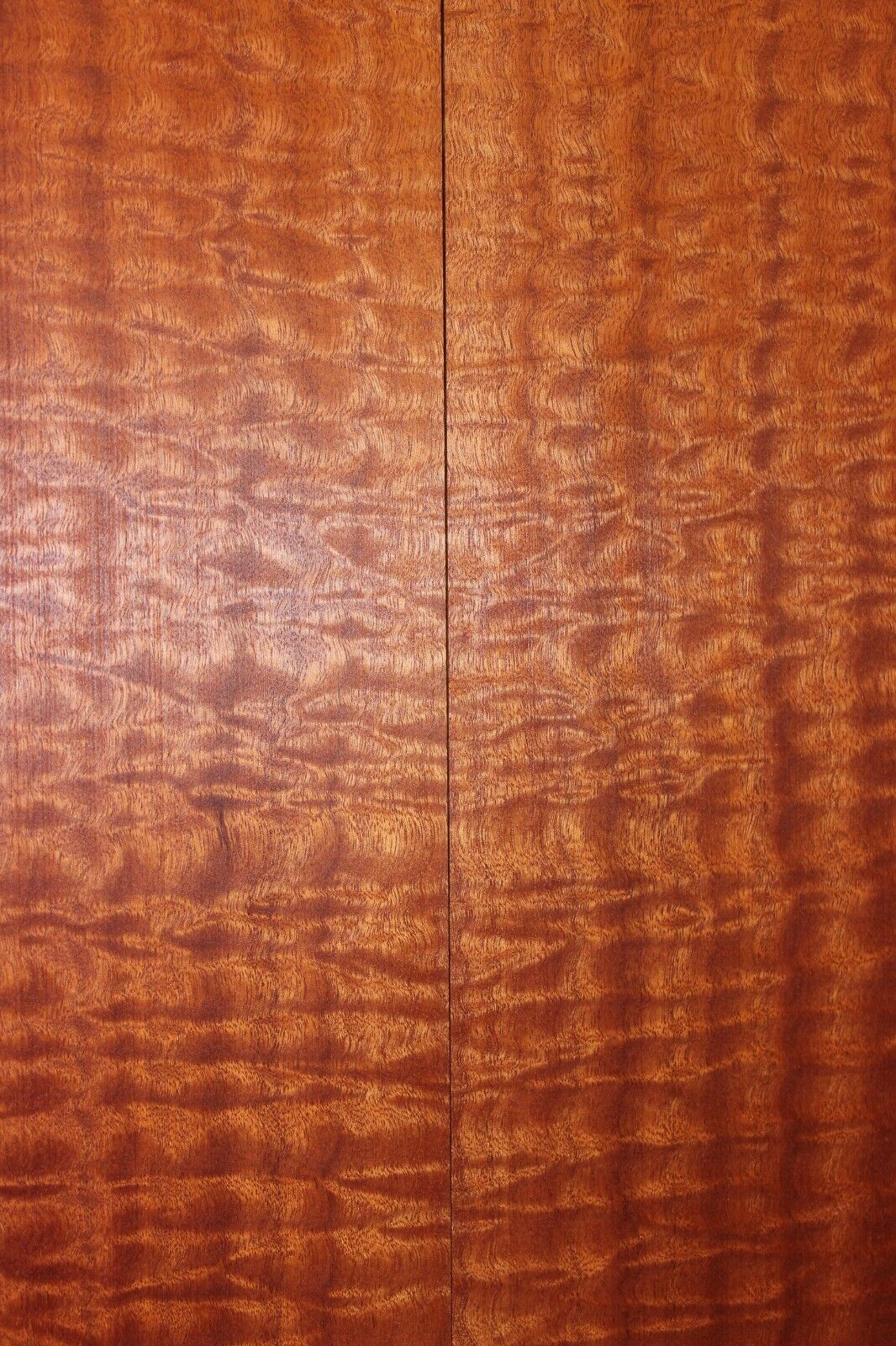 Quilted sapele electric guitar bookmatched drop top. Master grade figure.