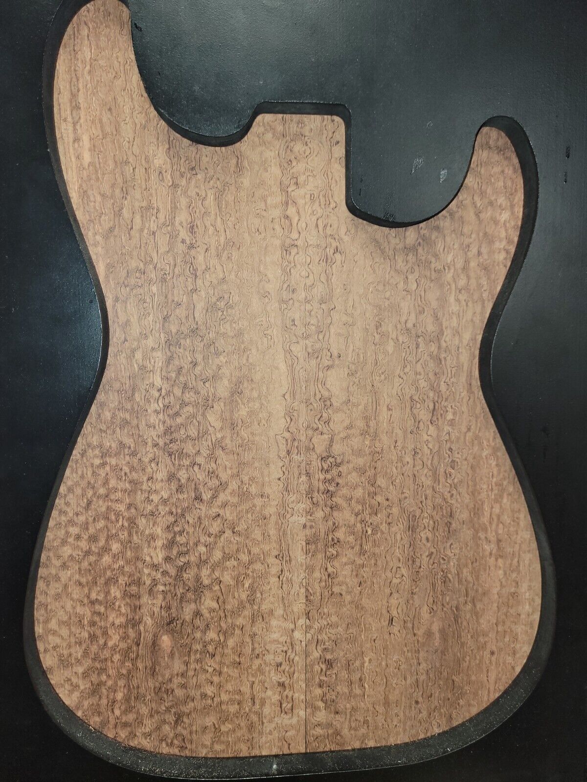 Pomelle figured bubinga electric guitar drop top.