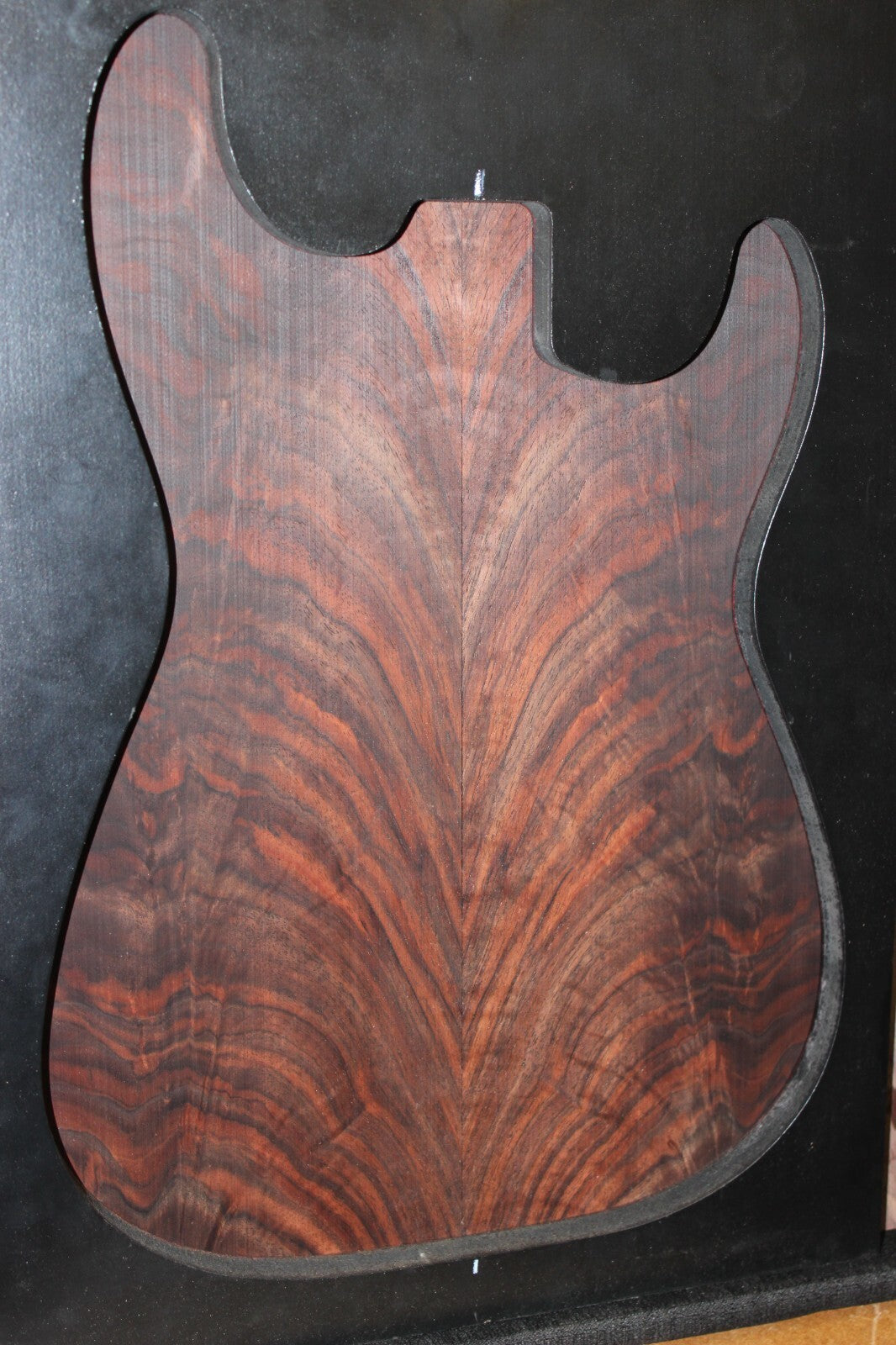 Black walnut crotch figured book matched guitar top.