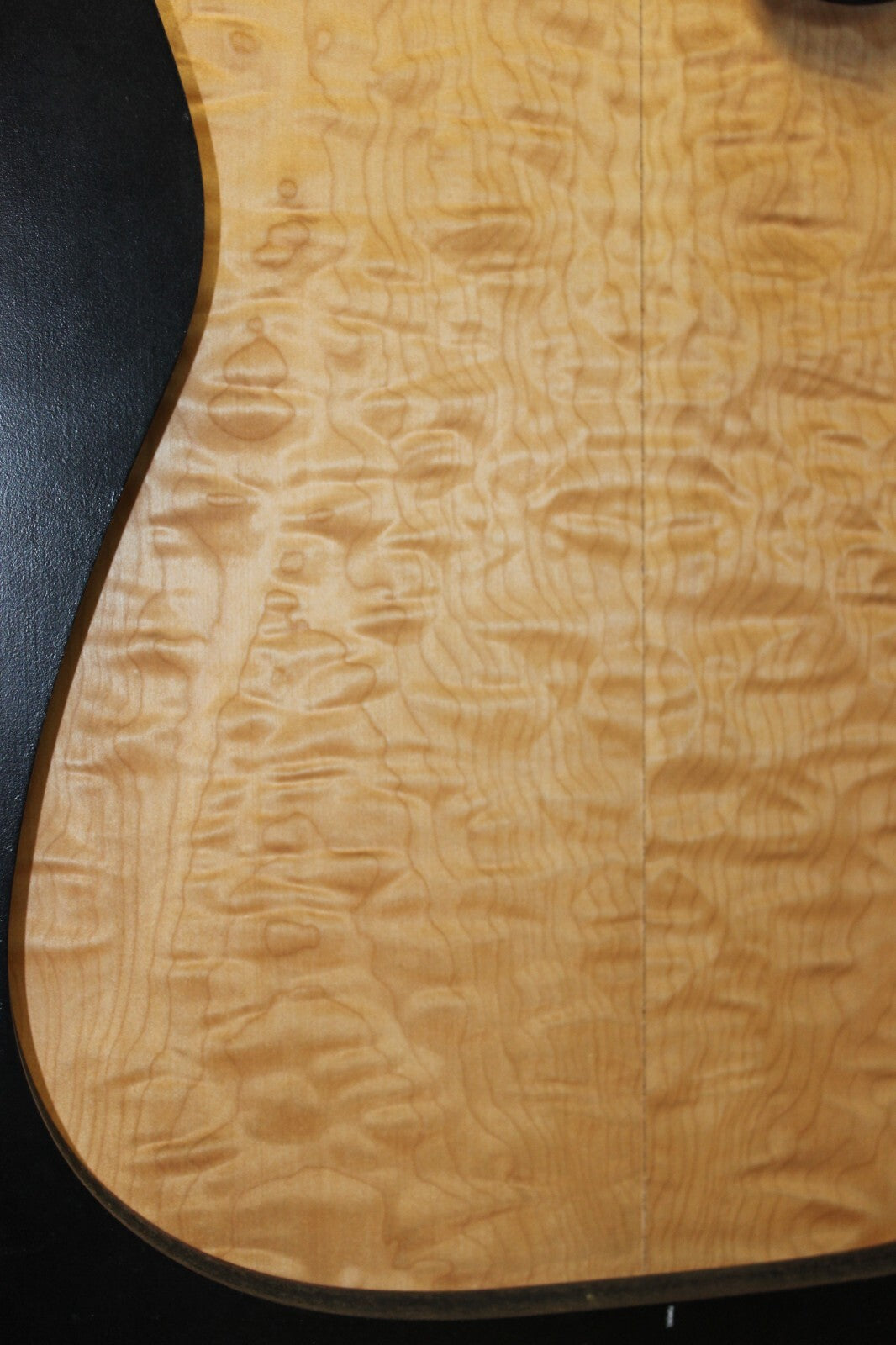Quilted maple book matched guitar drop top.