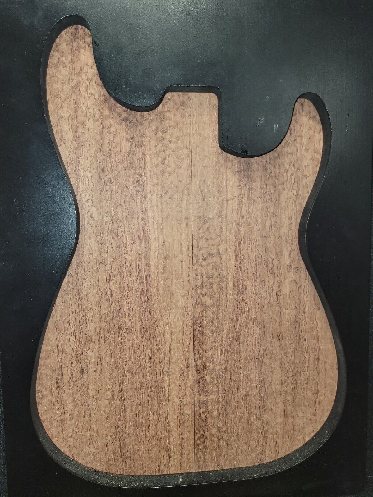 Pomelle figured bubinga electric guitar drop top.