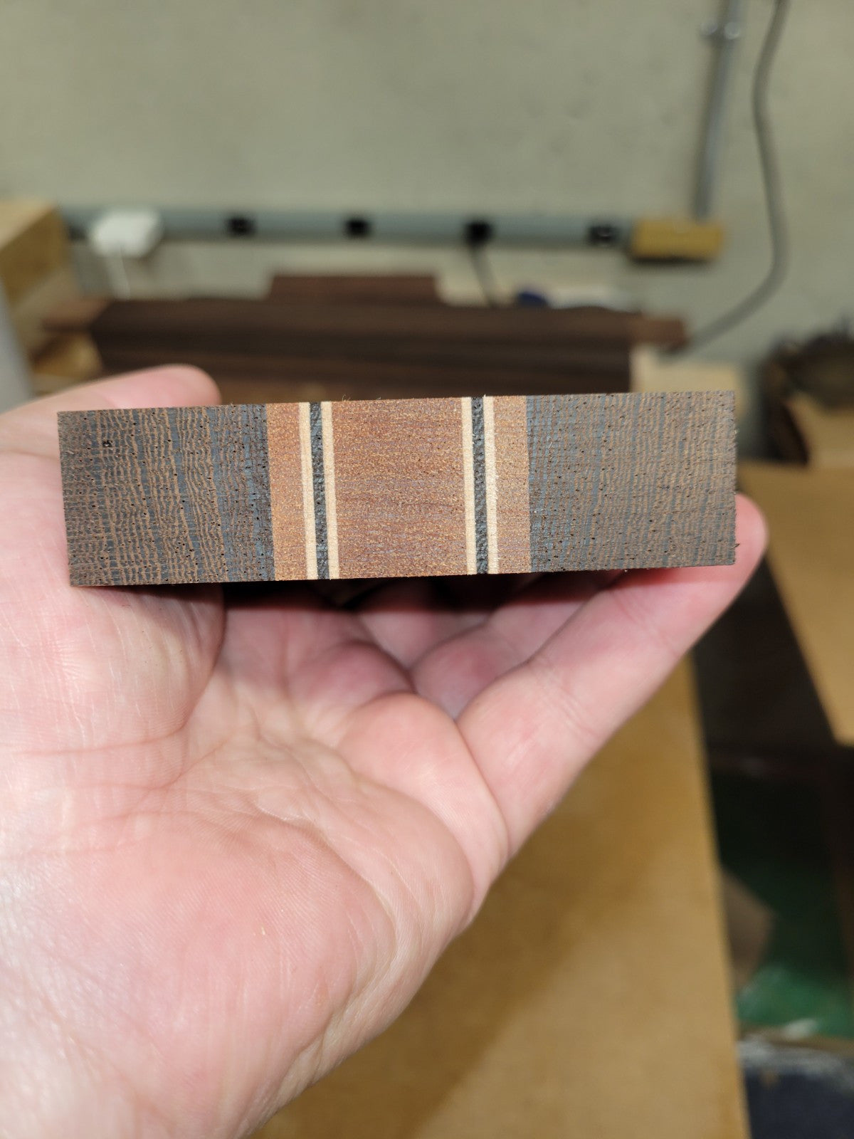 Quilted sapele, wenge and flame maple laminated guitar neck blank.