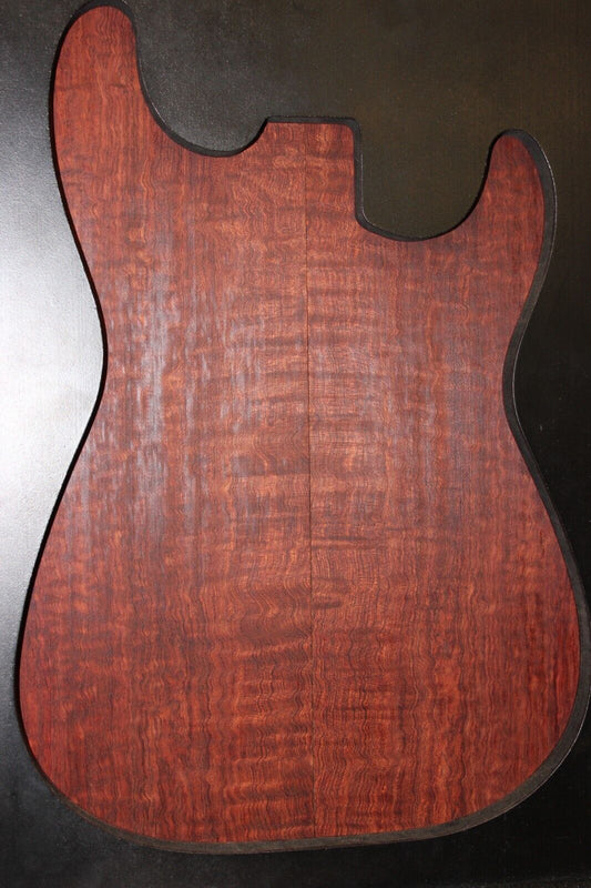 Figured bubinga electric guitar drop top. Curly / pomelle figure & rich color.