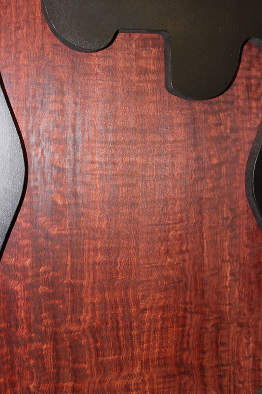 Figured bubinga electric guitar drop top. Curly / pomelle figure & rich color.