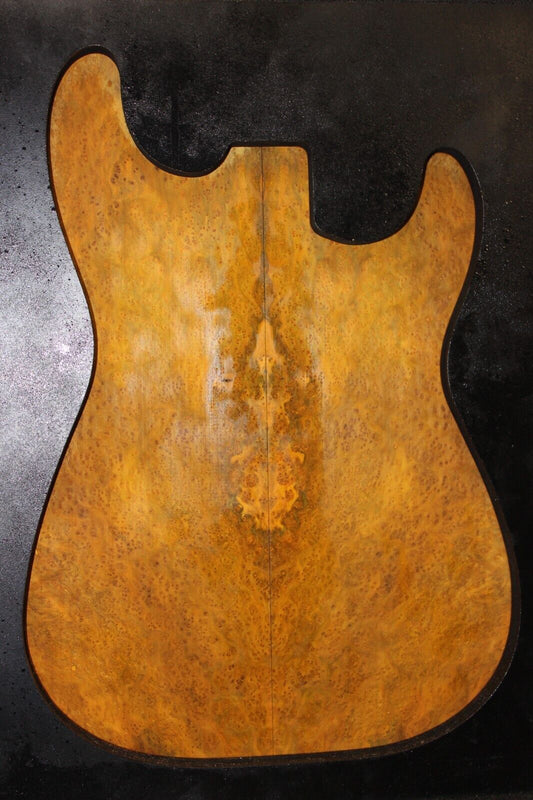 Golden Amboyna burl book matched guitar top.