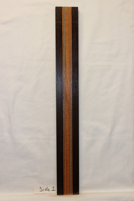 Figured mahogany, wenge and hard maple laminated guitar neck blank.