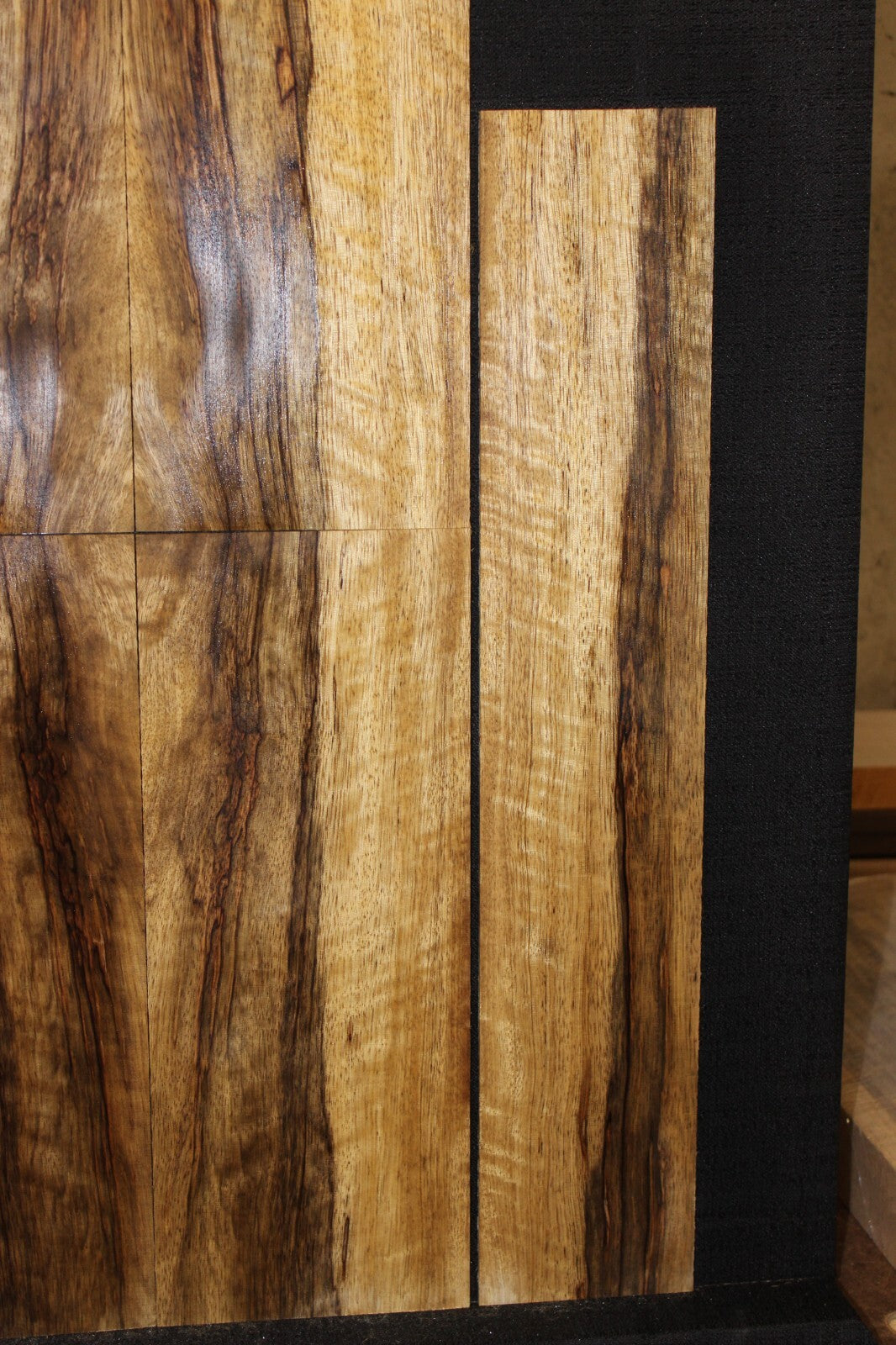 Quarter sawn figured black limba ukulele back, top and side set. Tenor size