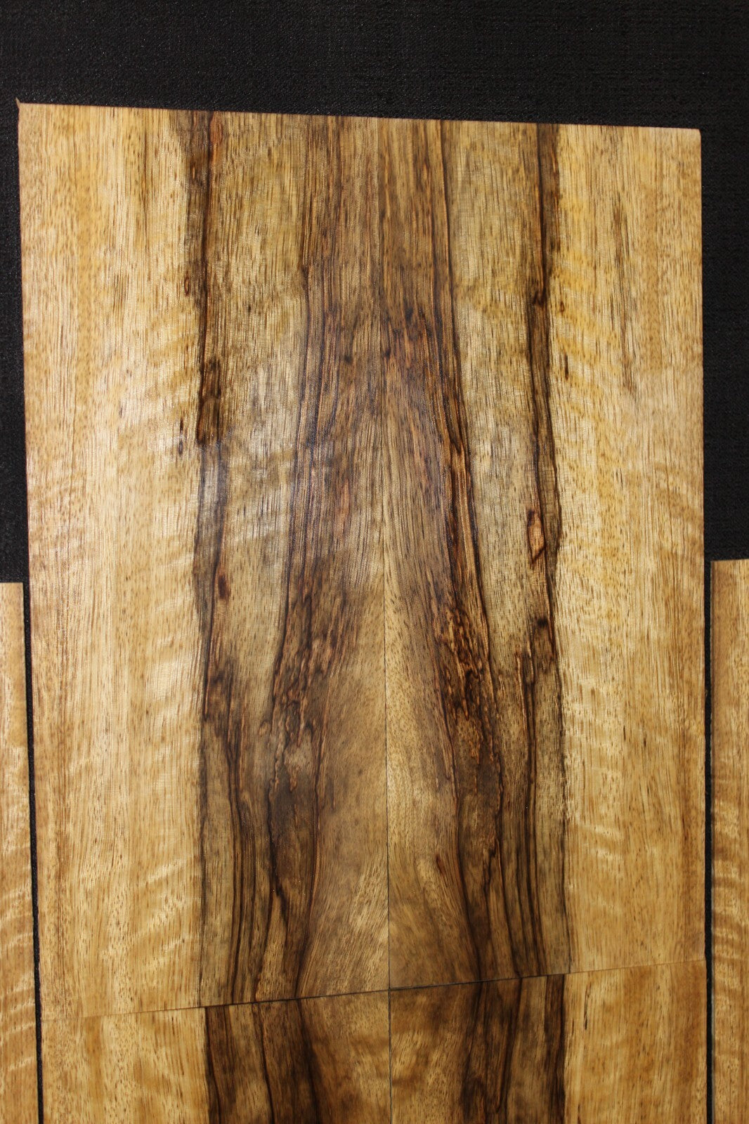 Quarter sawn figured black limba ukulele back, top and side set. Tenor size