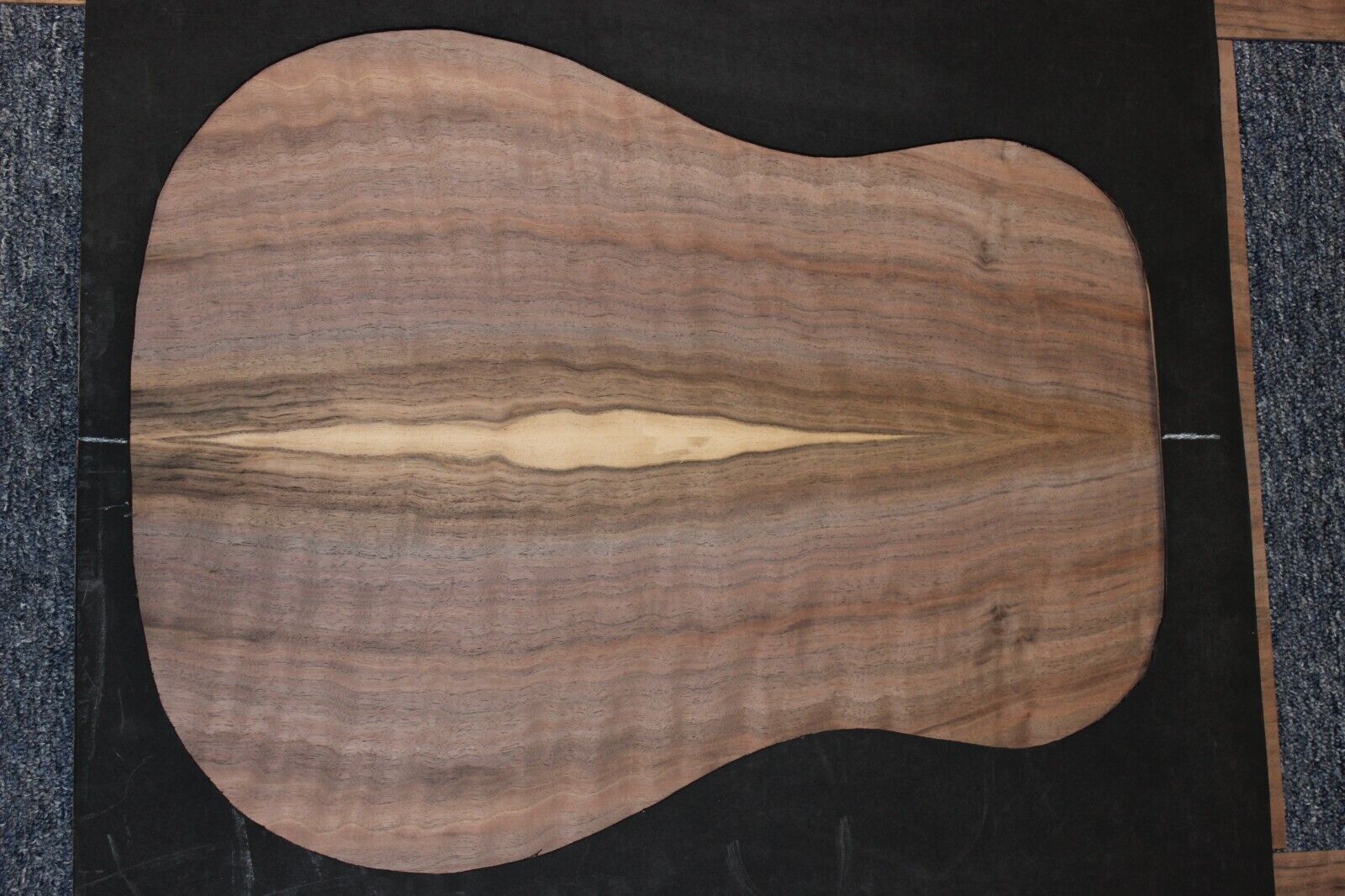Flame figured black walnut dreadnought size guitar back and side set.