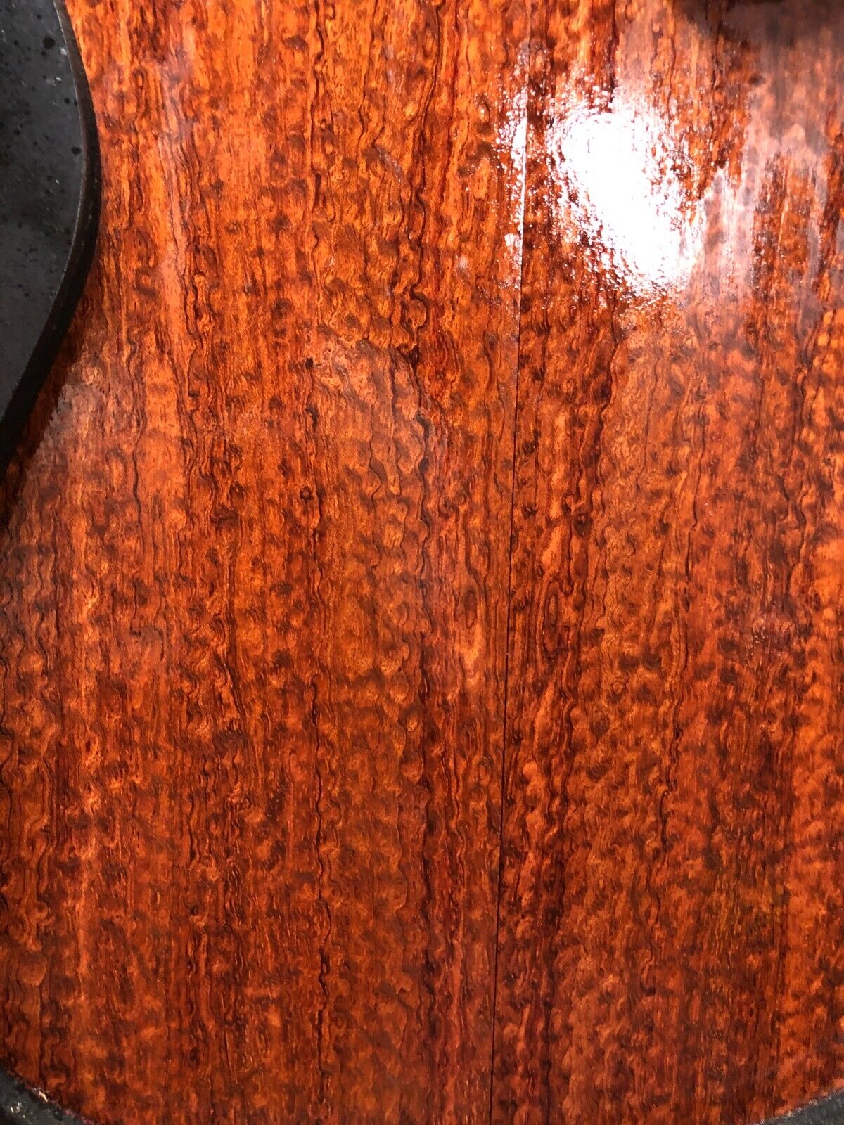 Pomelle figured bubinga electric guitar drop top.