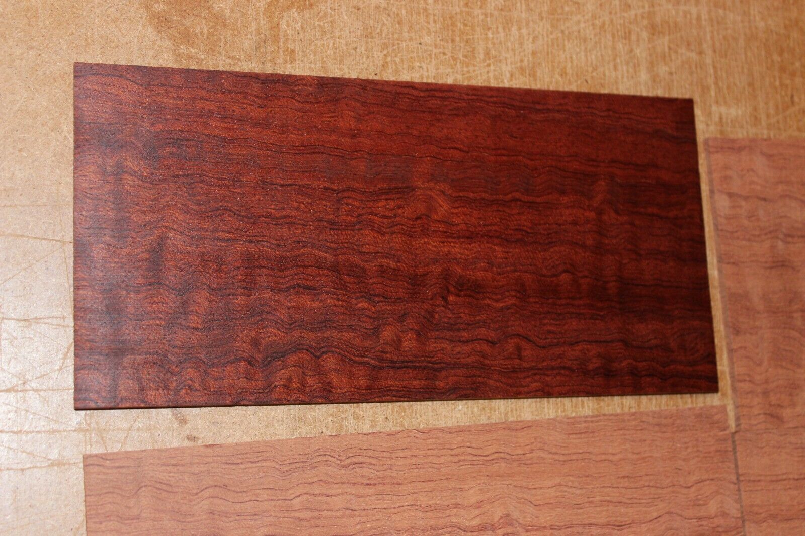 Quarter sawn figured bubinga headstock / peg head veneer. Sold individually