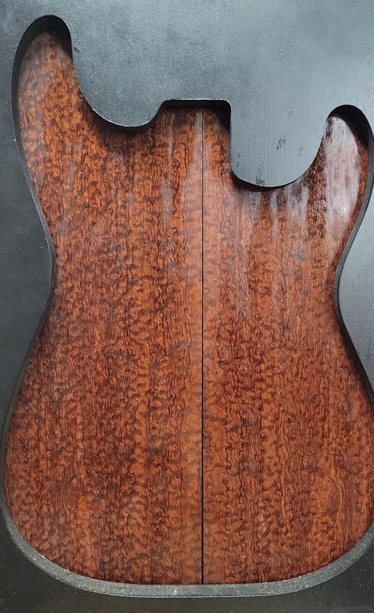 Pomelle figured bubinga electric guitar drop top.