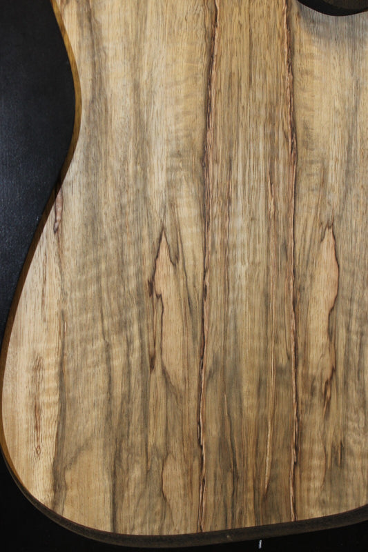 Curly black limba / korina figured book matched guitar top.