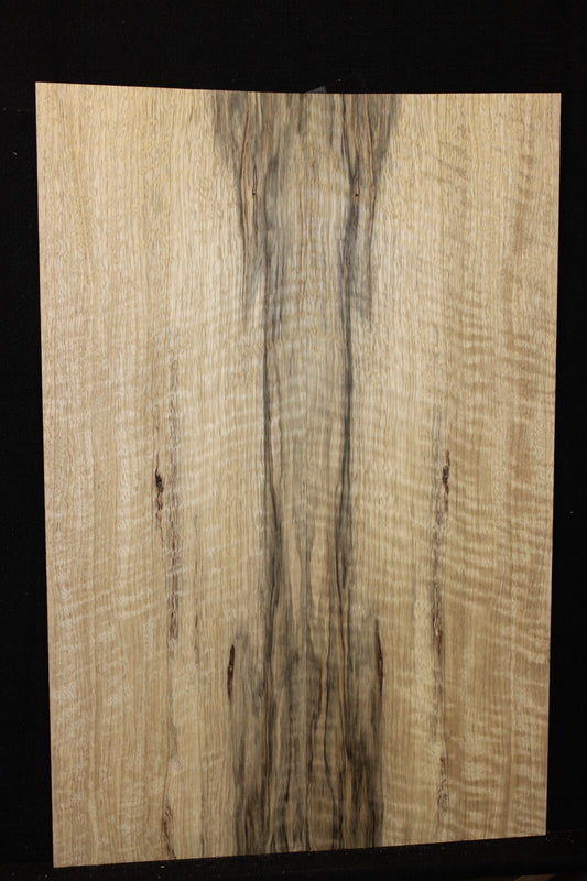 Curly black limba / korina figured book matched guitar top.