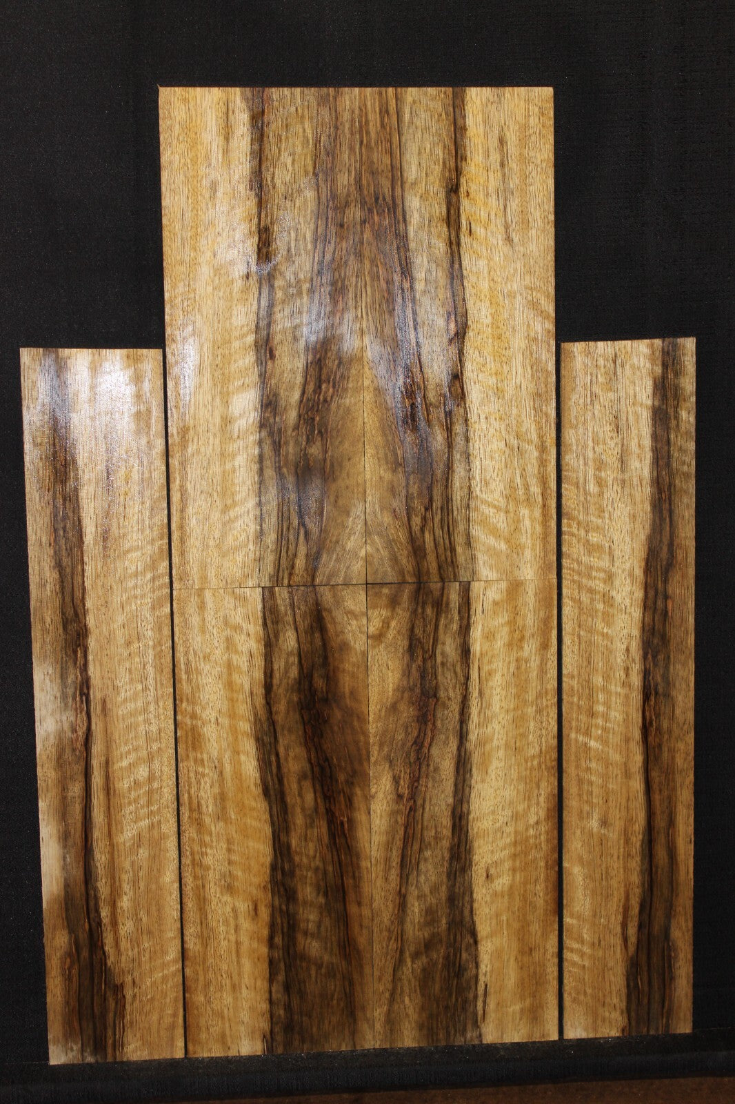 Quarter sawn figured black limba ukulele back, top and side set. Tenor size